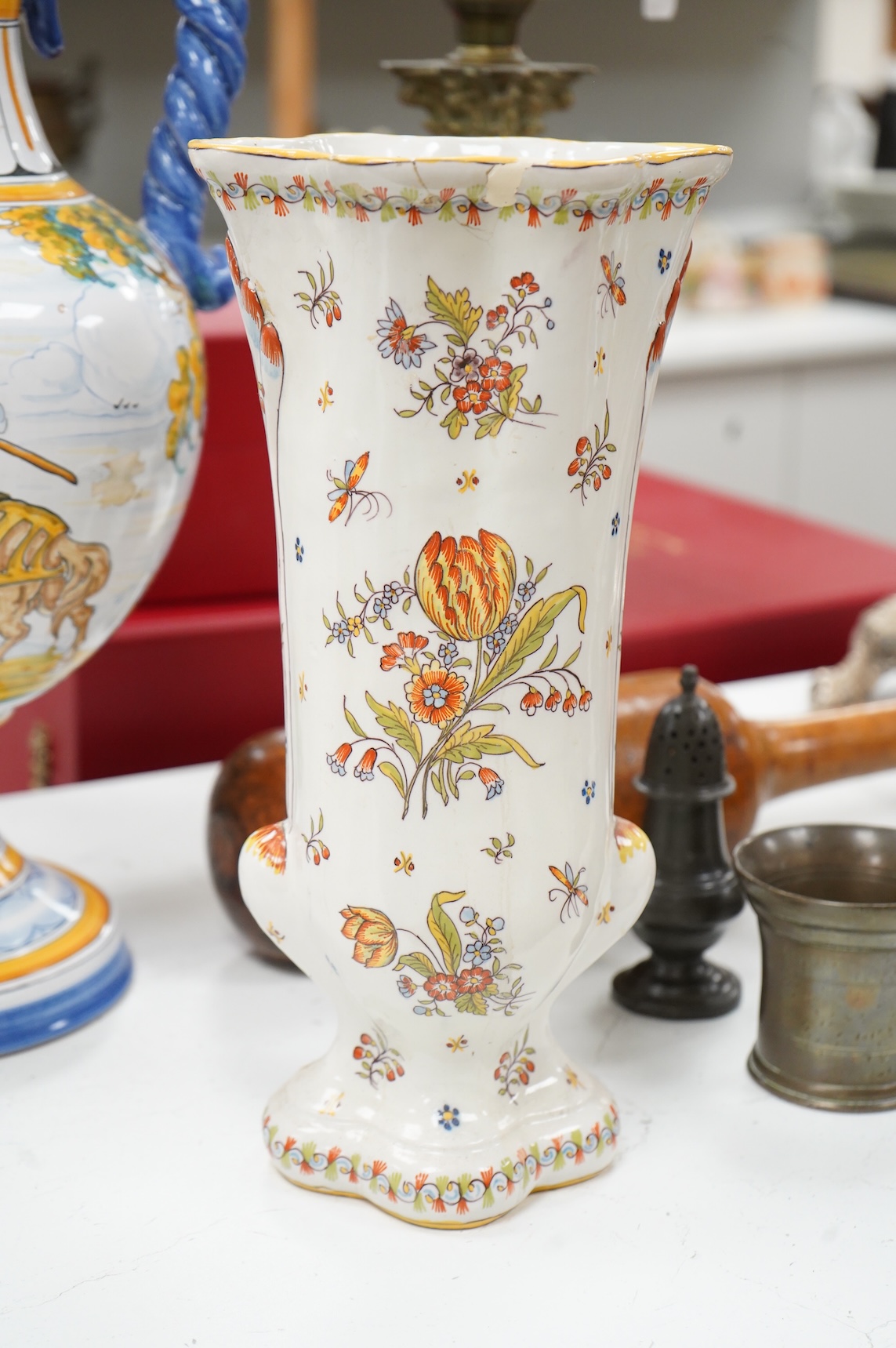 Two large French faience jugs and a vase, and a Talavera twin handled urn/vase, 44cm high